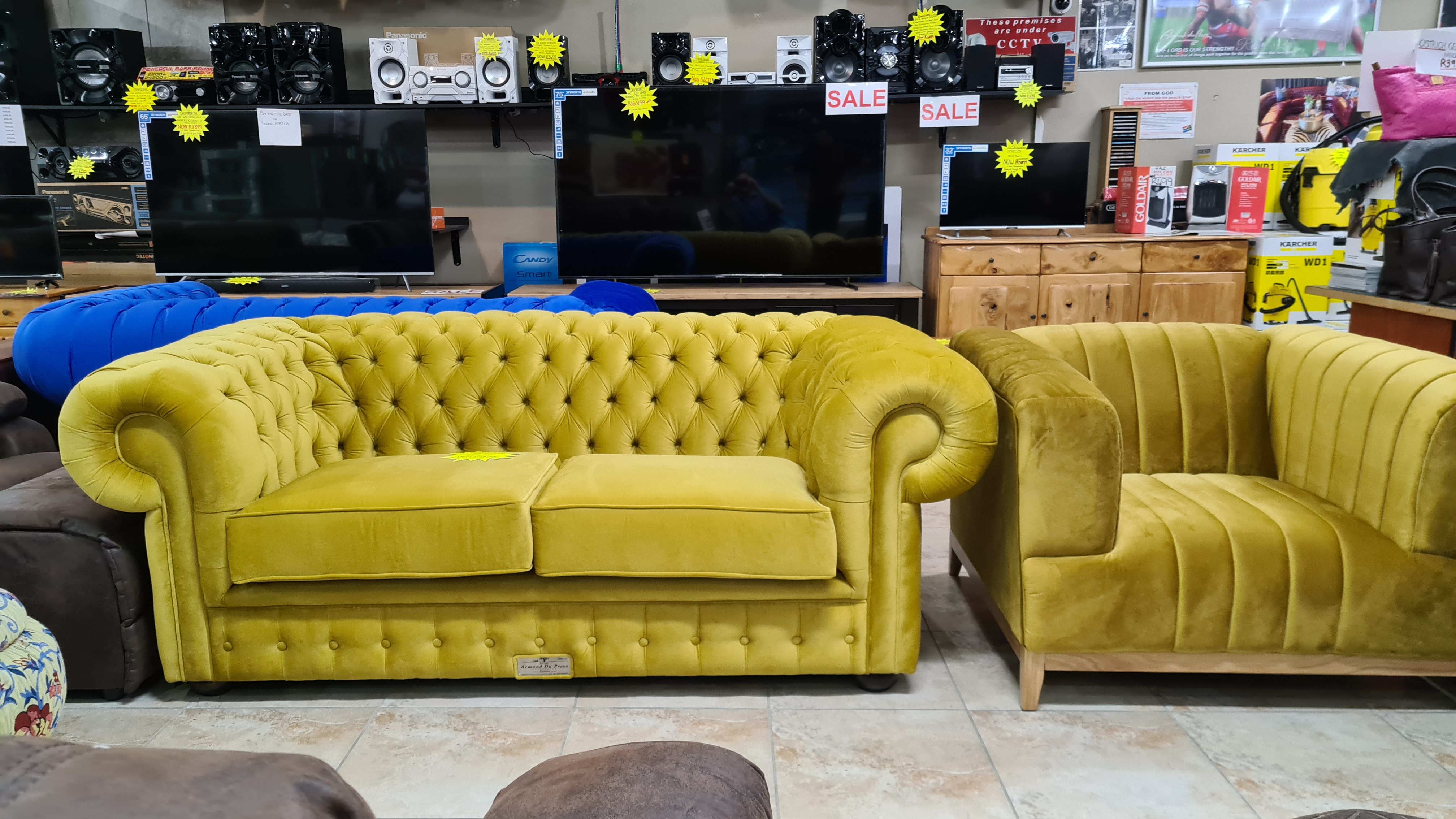 Gold fabric Chesterfield three-seater couch